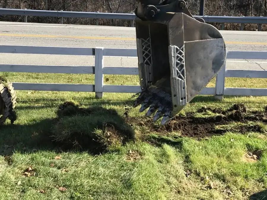 Excavation work beside an existing fence and finished property